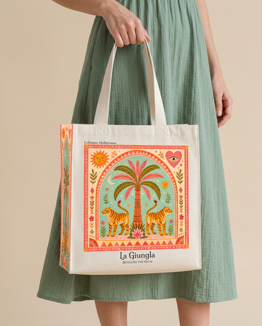 La Giungla tiger tote bag held by model in sage dress